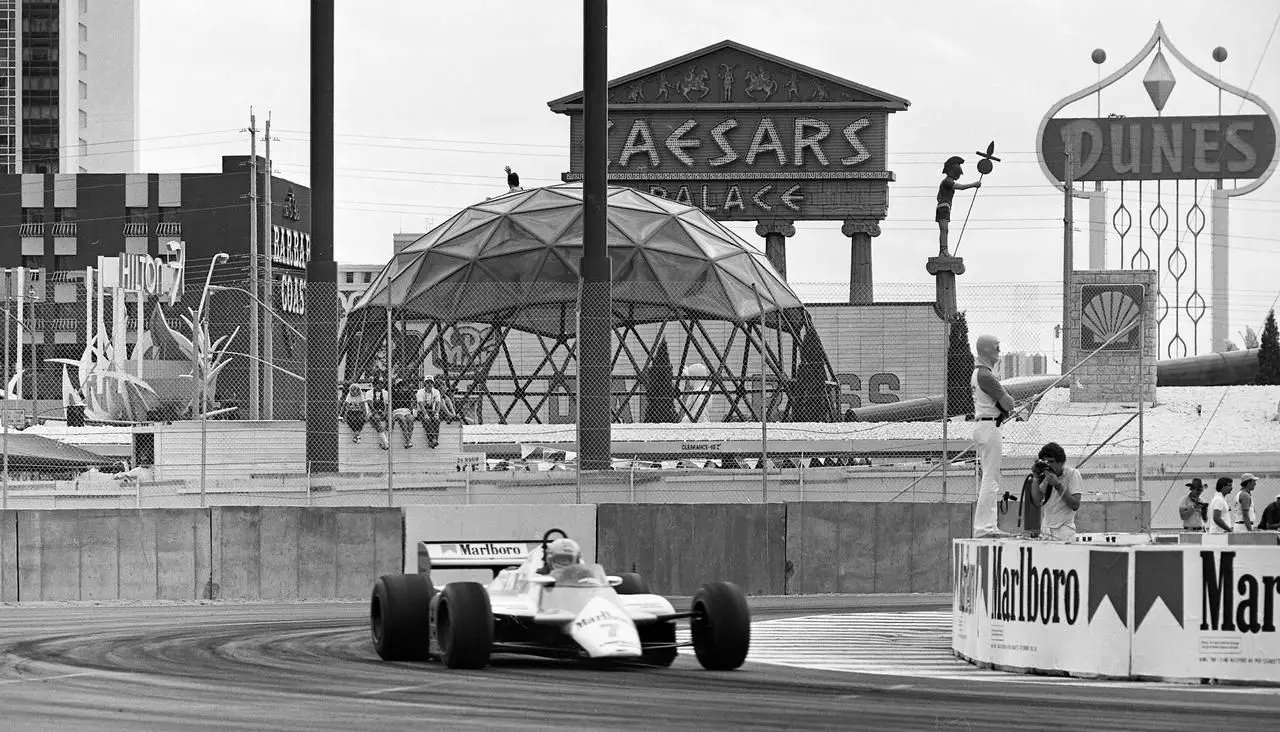 A Formula 1 car on the 1982 Caesars Palace Grand Prix circuit beside the Caesars sign